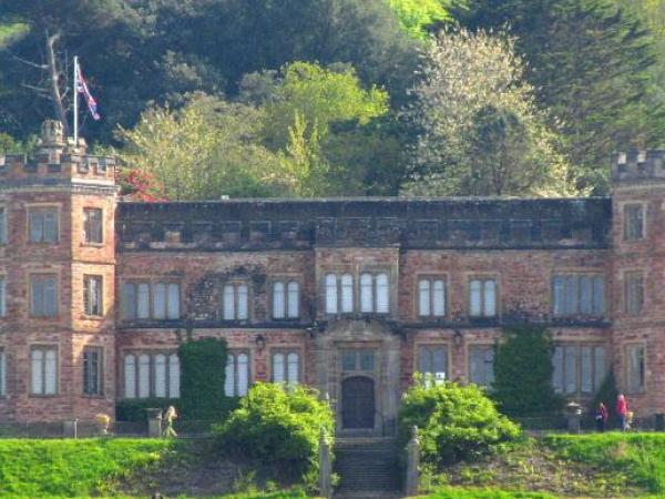 Mount Edgecumbe House, long low country house with turrets either end.
