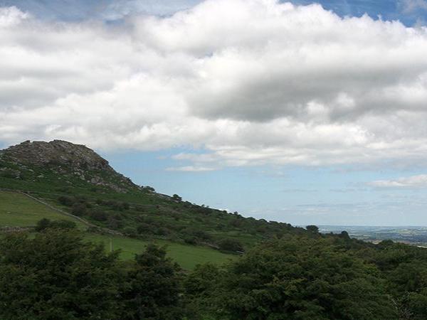 Farmland and tor on edge of Bodmin Moor