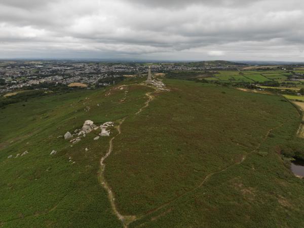Carn Brea seen from the air. Hill, rocks, monument.