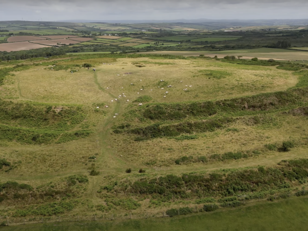 Photo of Castle an Dinas taken from the air, with grazing sheep not piskeys.